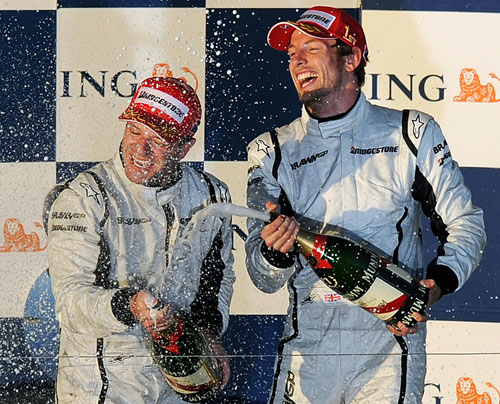 Jenson Button and Rubens Barrichello celebrate after the Australian Grand Prix