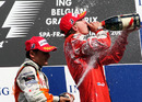 Kimi Raikkonen and Giancarlo Fisichella celebrate on the podium