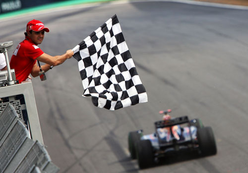 Ferrari's Felipe Massa waves home race winner Mark Webber