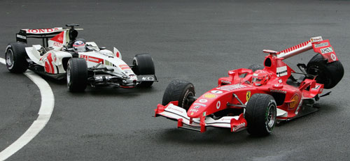 Michael Schumacher collides with Takuma Sato