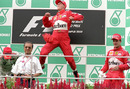 Michael Schumacher celebrates his win in the Malaysian Grand Prix