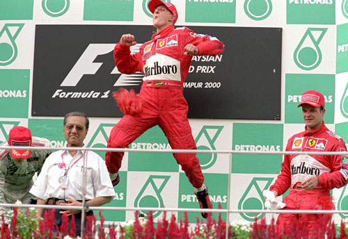 Michael Schumacher celebrates his win in the Malaysian Grand Prix