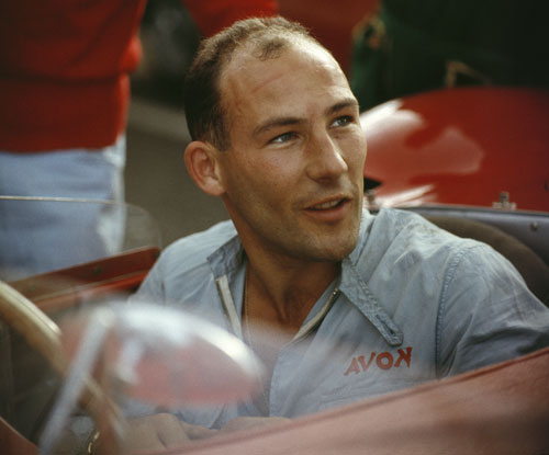 Stirling Moss sitting in his Maserati 300S