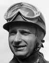 A pre-race portrait of Juan Manuel Fangio