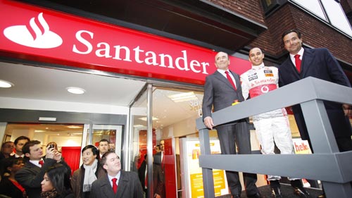 Lewis Hamilton helps chairman Emilio Botin open a newly-rebranded bank