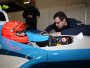 Michael Schumacher talks with a GP2 engineer