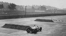 Robert Benoist driving a Delage practising his turns ahead of the inaugural British Grand Prix 