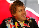 Sebastian Vettel relaxes during a wet practice session