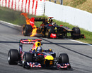 Sebastian Vettel passes Nick Heidfeld's burning Renault