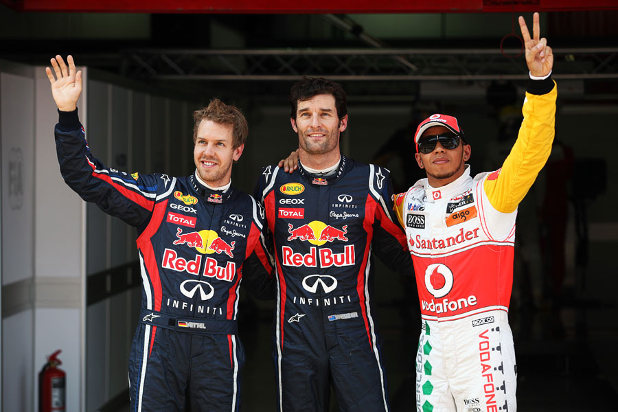 Mark Webber smiles with Sebastian Vettel and Lewis Hamilton after securing pole position