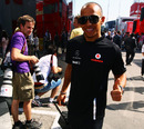 Lewis Hamilton arrives in the paddock on race day morning
