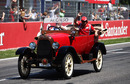 Fernando Alonso waves to his fans on the drivers' parade