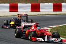 Fernando Alonso leads Sebastian Vettel early in the race