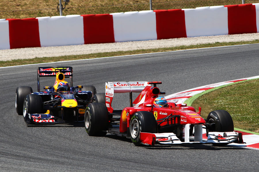Mark Webber struggles to find a way past Fernando Alonso