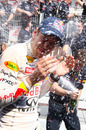 Sebastian Vettel is bathed in champagne after taking his fourth victory of the season