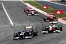 Rubens Barrichello leads the Tonio Liuzzi in to turn one