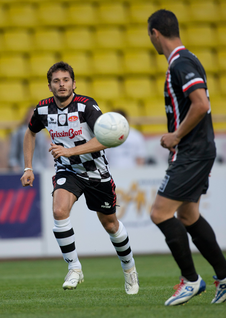 Former driver Giancarlo Fisichella takes part in a charity football match in Monaco