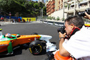 Photographers try to get a shot of Paul di Resta at work