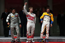 Davide Valsecchi celebrates his win in the GP2 feature race on the podium with Alvaro Parente and Luca Filippi