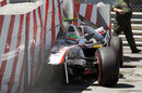 Sergio Perez sits in his car following his big accident towards the end of qualifying