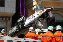 The remains of Sergio Perez's car are lifted away