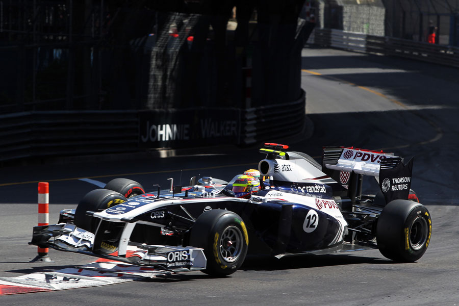 Lewis Hamilton and Pastor Maldonado come together at turn one