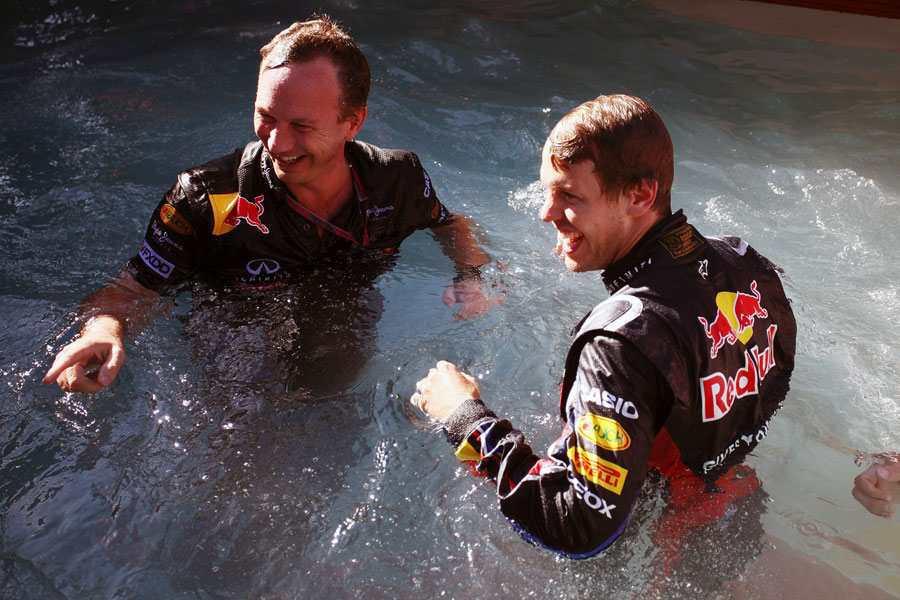 Sebastian Vettel and Christian Horner celebrate in the Red Bull swimming pool