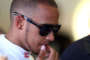 Lewis Hamilton mulls over his practice session in the McLaren garage