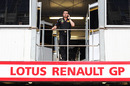 Eric Boullier makes a call above the Renault garage