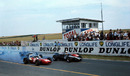 John Surtees leads away Lorenzo Bandini and Michael Parkes