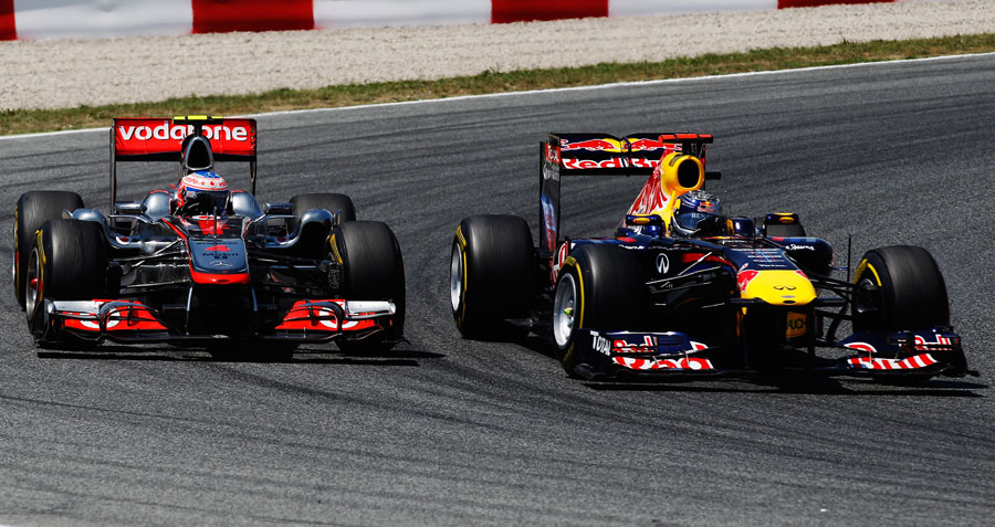 Jenson Button and Sebastian Vettel battle on track
