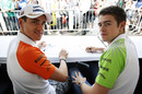 Adrian Sutil and Paul di Resta at the fans autograph session