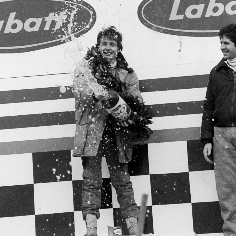 Gilles Villeneuve sprays beer on the podium
