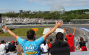 Fernando Alonso receives support as he passes the grandstands