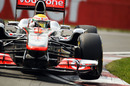 Lewis Hamilton lifts a wheel in the McLaren