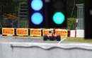 Fernando Alonso heads down to turn one