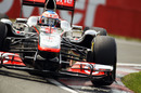 Jenson Button attacks the kerbs in his McLaren