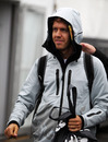 Sebastian Vettel shelters from the rain