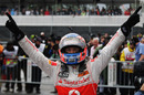 Jenson Button celebrates his remarkable victory