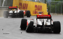Jenson Button speeds away while Lewis Hamilton limps into retirement after their collision