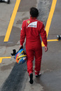 Fernando Alonso trudges back to the pits after his retirement