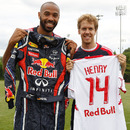 Footballer Thierry Henry and Sebastian Vettel swap a shirt for a racesuit following a training session with the New York Red Bulls