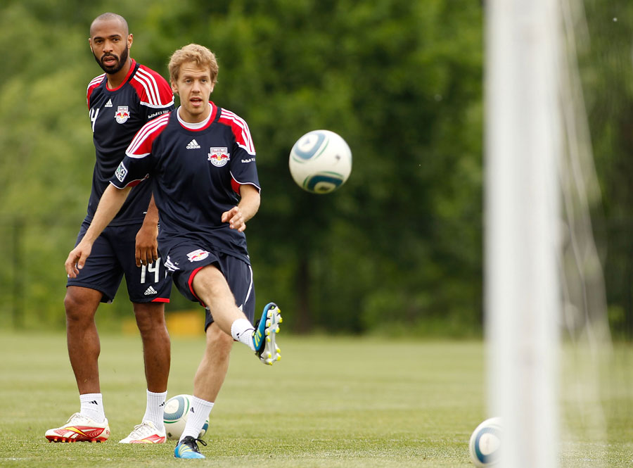 Thierry Henry gives Sebastian Vettel some tips during a training session with the New York Red Bulls