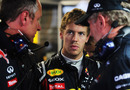 Sebastian Vettel talks to his Red Bull team in the garage