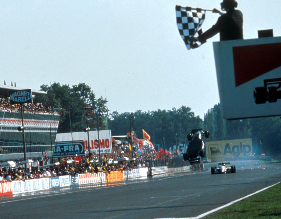 Christian Fittipaldi launches off the back of his team-mate Pierluigi Martini