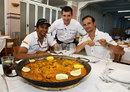 Narain Karthikeyan, Tonio Liuzzi and race engineer Antonio Cuquerella pose with their paella