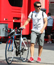 Timo Glock arrives in the paddock with his bike