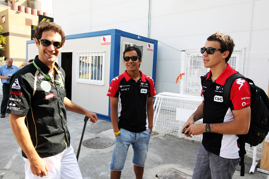 F1 reserve drivers Bruno Senna, Sakon Yamamoto and Robert Wickens in the paddock