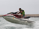 Tonio Liuzzi takes jumps waves on a jetski on Thursday