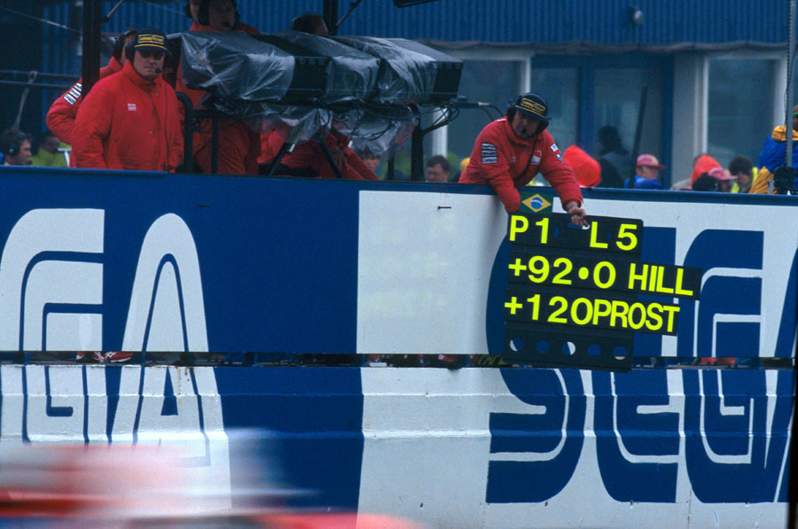 Ayrton Senna passes his pitboard showing his substantial lead over the rest of the field
